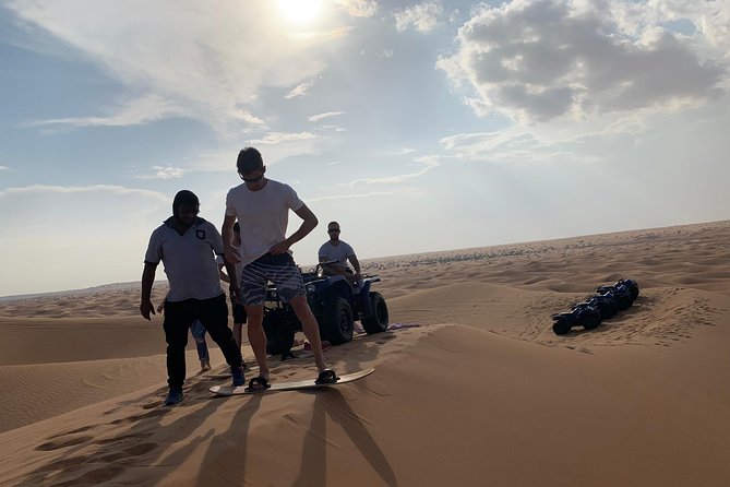 Dubai: Unique SUNSET Quad Bike Red Dunes Safari - BBQ dinner and the traditional camp program