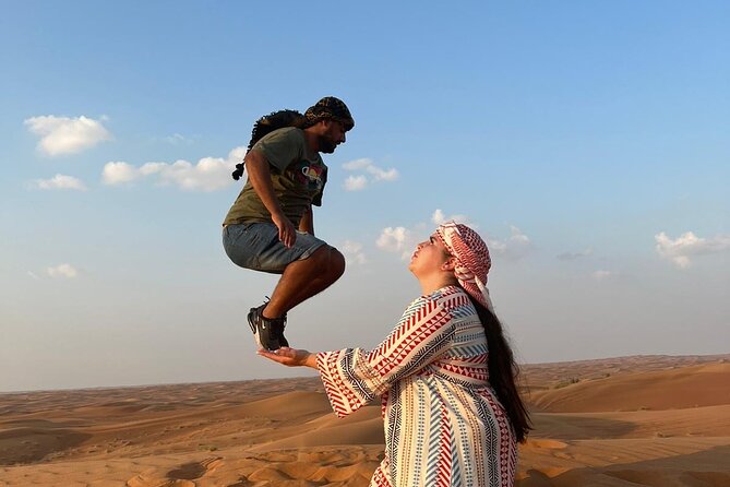 Evening Desert Safari Camel Ride Dinner Live Shows in Abu Dhabi - Sandboarding for an easy extra thrill