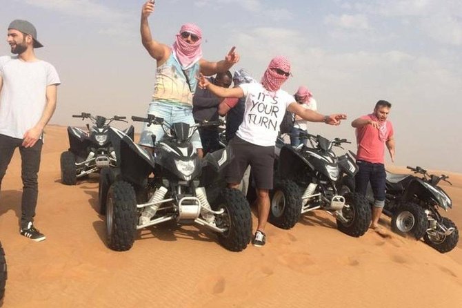 Evening Red Dunes Safari with Quad Biking, BBQ Dinner & LiveShows - Belly dancing, Tanoura, and fire performances