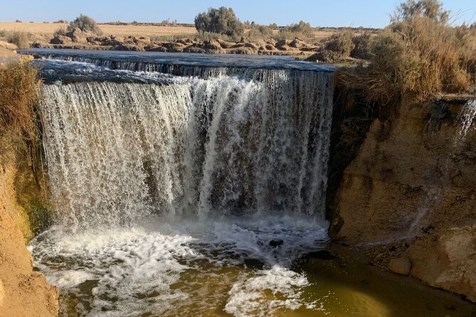From Cairo: Desert Safari, Waterfalls, Sand boarding and Camel ride with Lunch - Mudawara Mountain offers the best photo stop