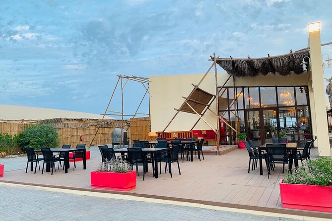 Full-day Qatar desert safari: dune bashing, sandboarding, camels - Sandboarding and Qatar’s singing dunes