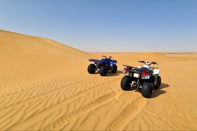 Guided Desert Safari with Dinner and Quad Biking in Dubai - Dune bashing across Lahbab’s red sand