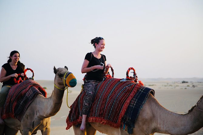 Morning Desert Safari with Camel Ride & Sand Skiing Private Tours - Sunrise from the top of a dune