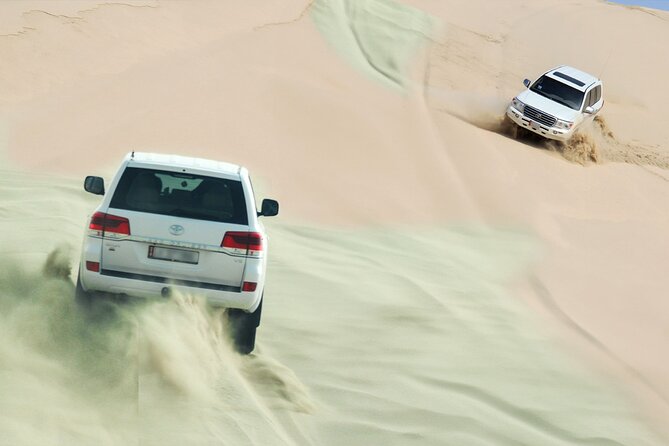 Private Half Day Desert Safari with Camel Ride - Khor Al Udeid, where the sand reaches the sea