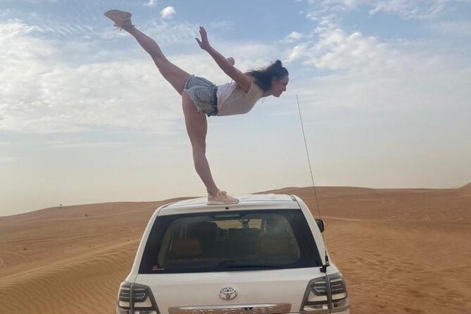 Red Dunes Desert Safari with 4x4 Pick up & Drop, Camel ride, BBQ and Live shows - Sunset photography on the red sand