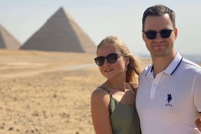 Top Tour Giza Pyramids ,Sphinx ,camel ride and ATV safari - Standing before the Great Sphinx